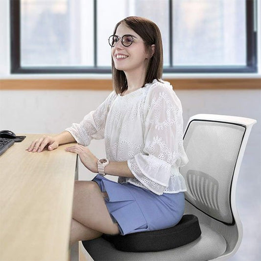 Coussin ergonomique femme travail bureau heureuse